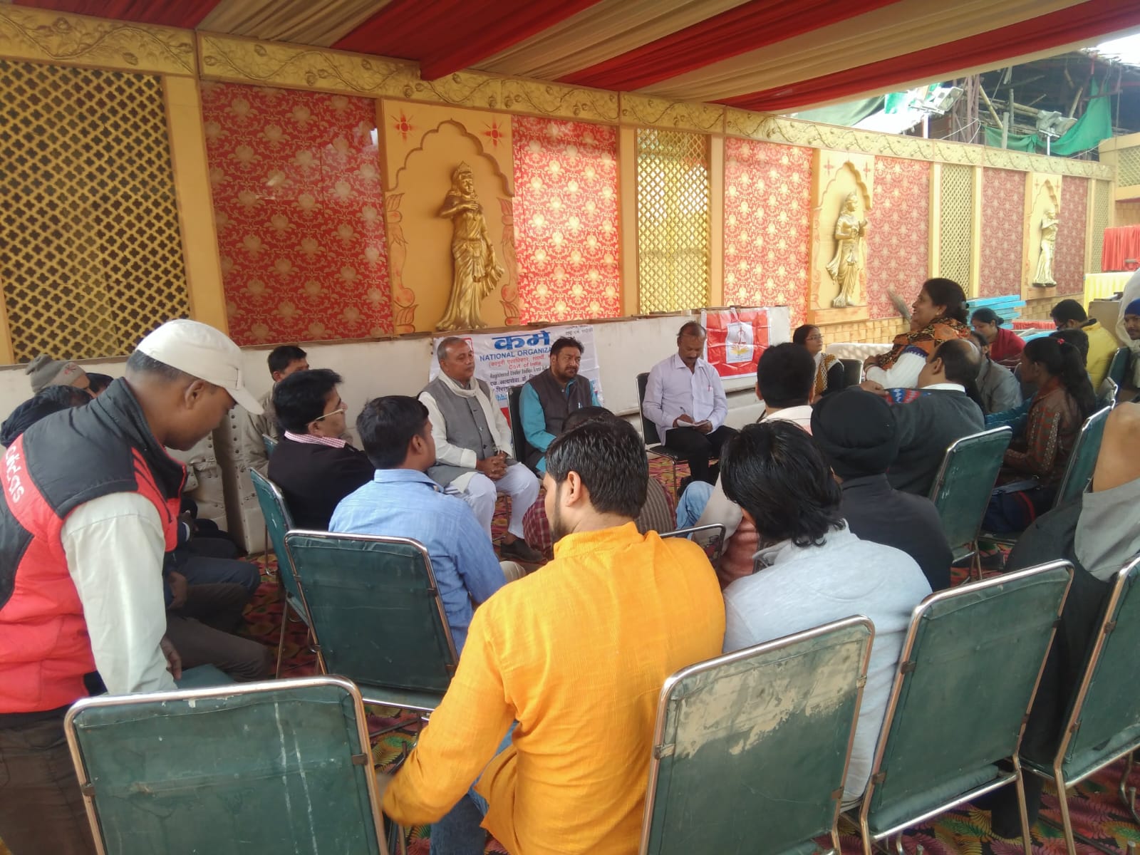 Karm National community meeting under a decorated pandal
