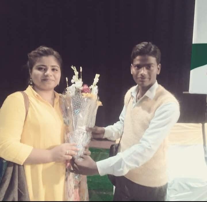 Saraswati Sharma being felicitated with a bouquet at a community recognition ceremony
